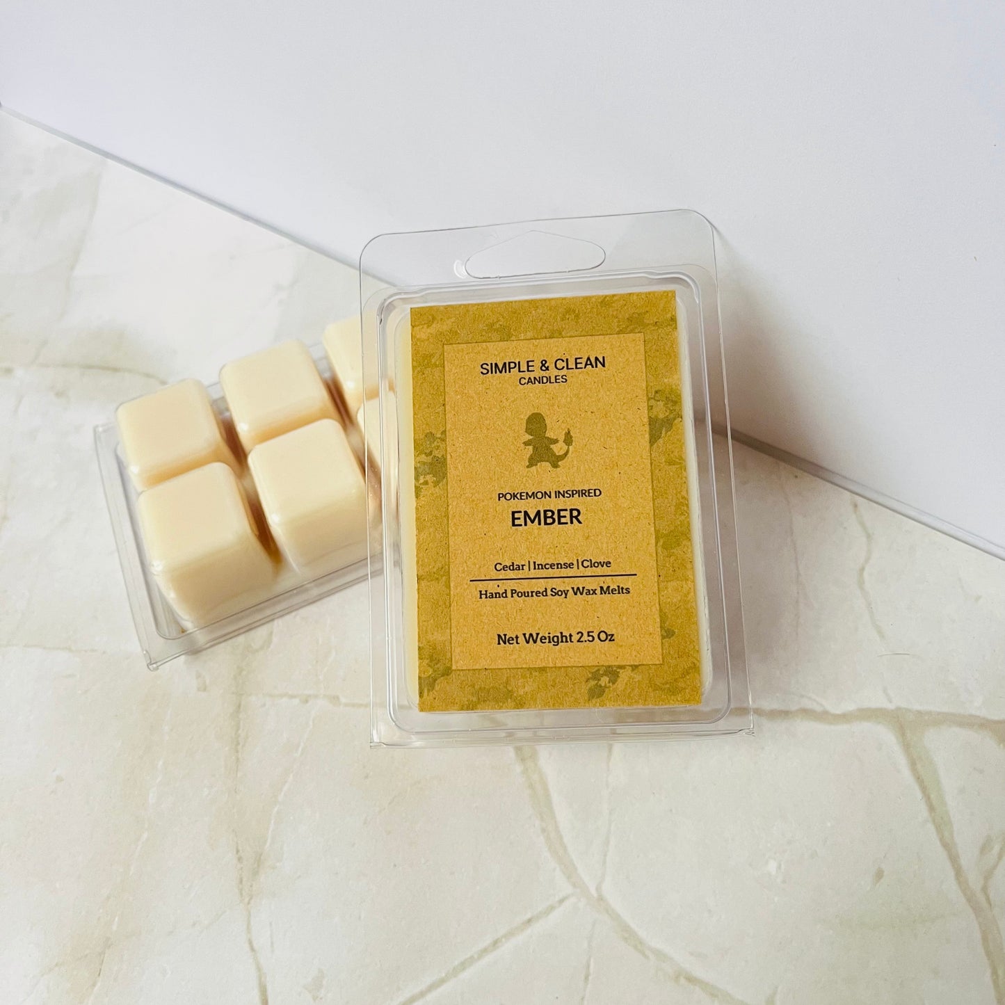 Wax melts in a clear packaging on a light surface with a white background